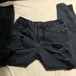 Used and black pants ripped